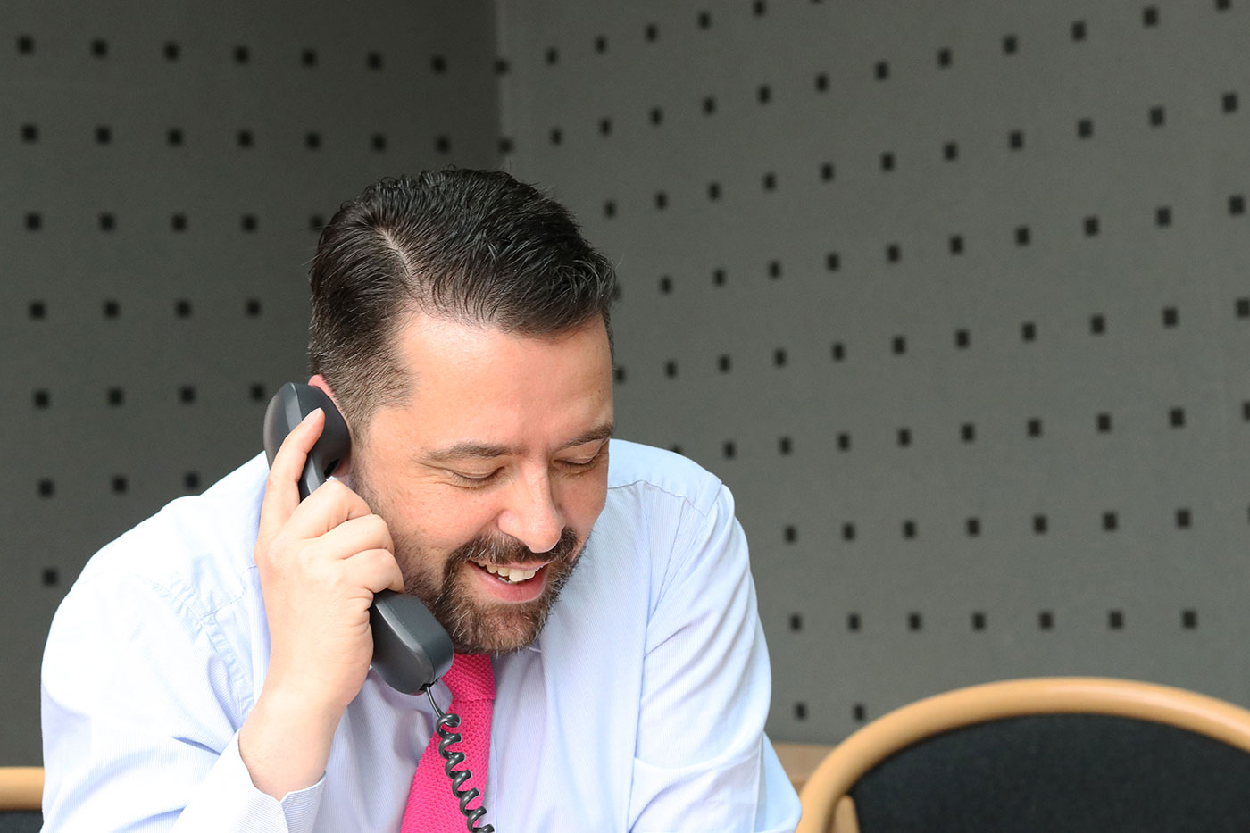 Richard Entwistle on phone call with client at the Black Norman office